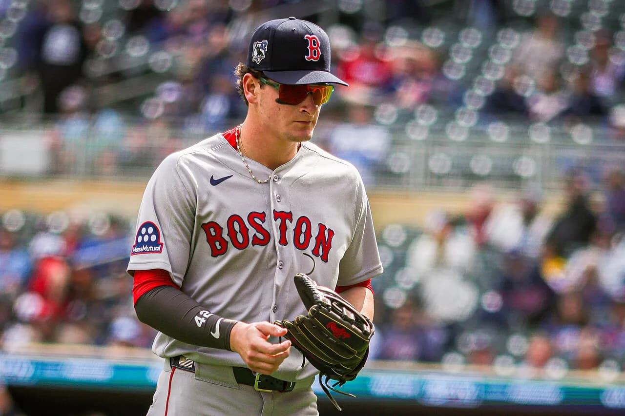 Roman Anthony walking back toward the dugout during a Red Sox game against the Twins