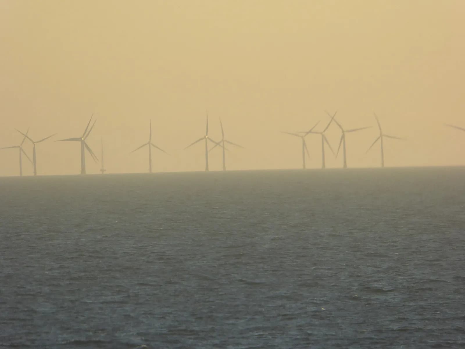 Offshore wind turbines at the Baltic 2 wind farm in the Baltic Sea, with the FINO 2 research platform at left.
