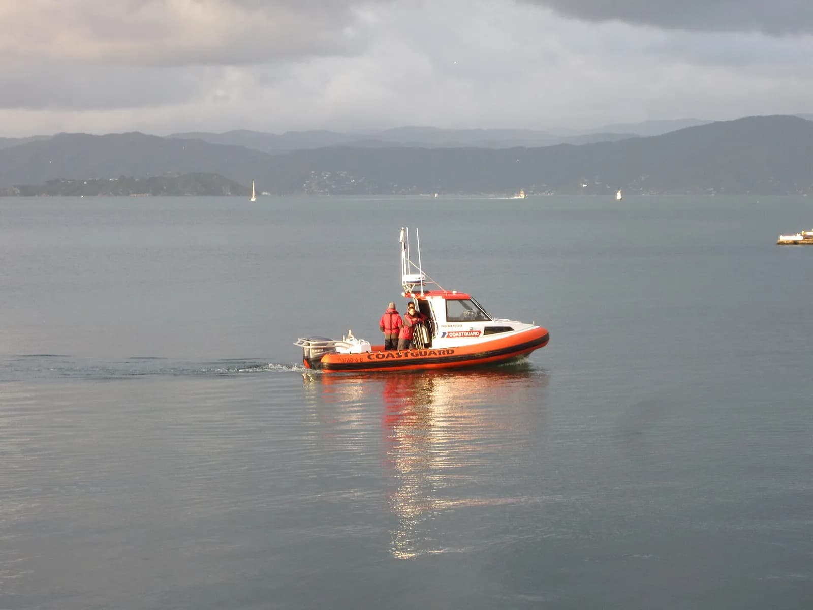 A small Royal New Zealand Coastguard boat on Wellington Harbour