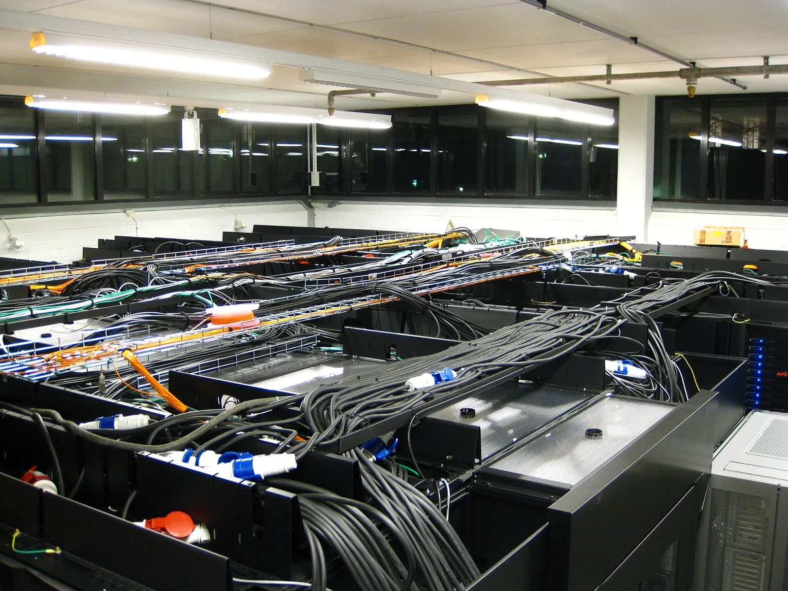 Rows of equipment, cabling and pipes in a server room at the Royal Institute of Technology in Stockholm.