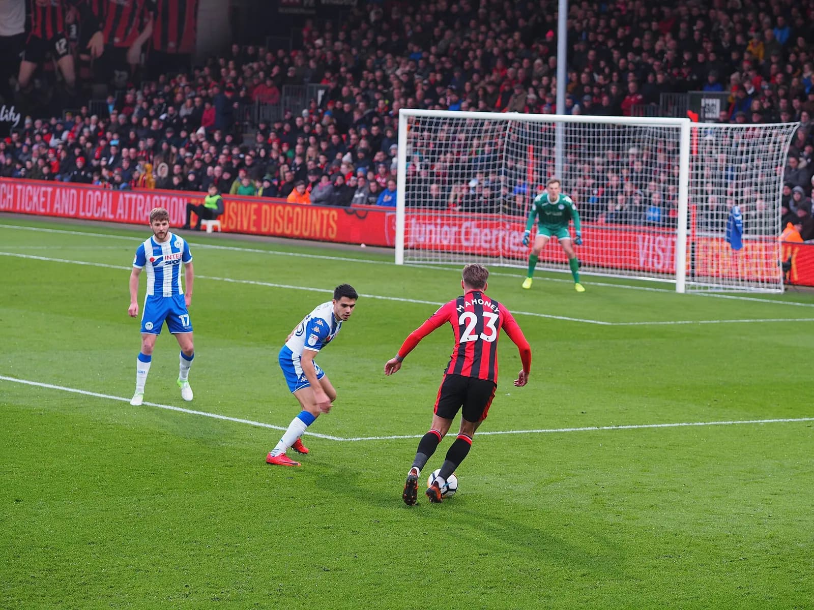 Football match at the Vitality Stadium, with Bournemouth and Wigan players on the pitch.