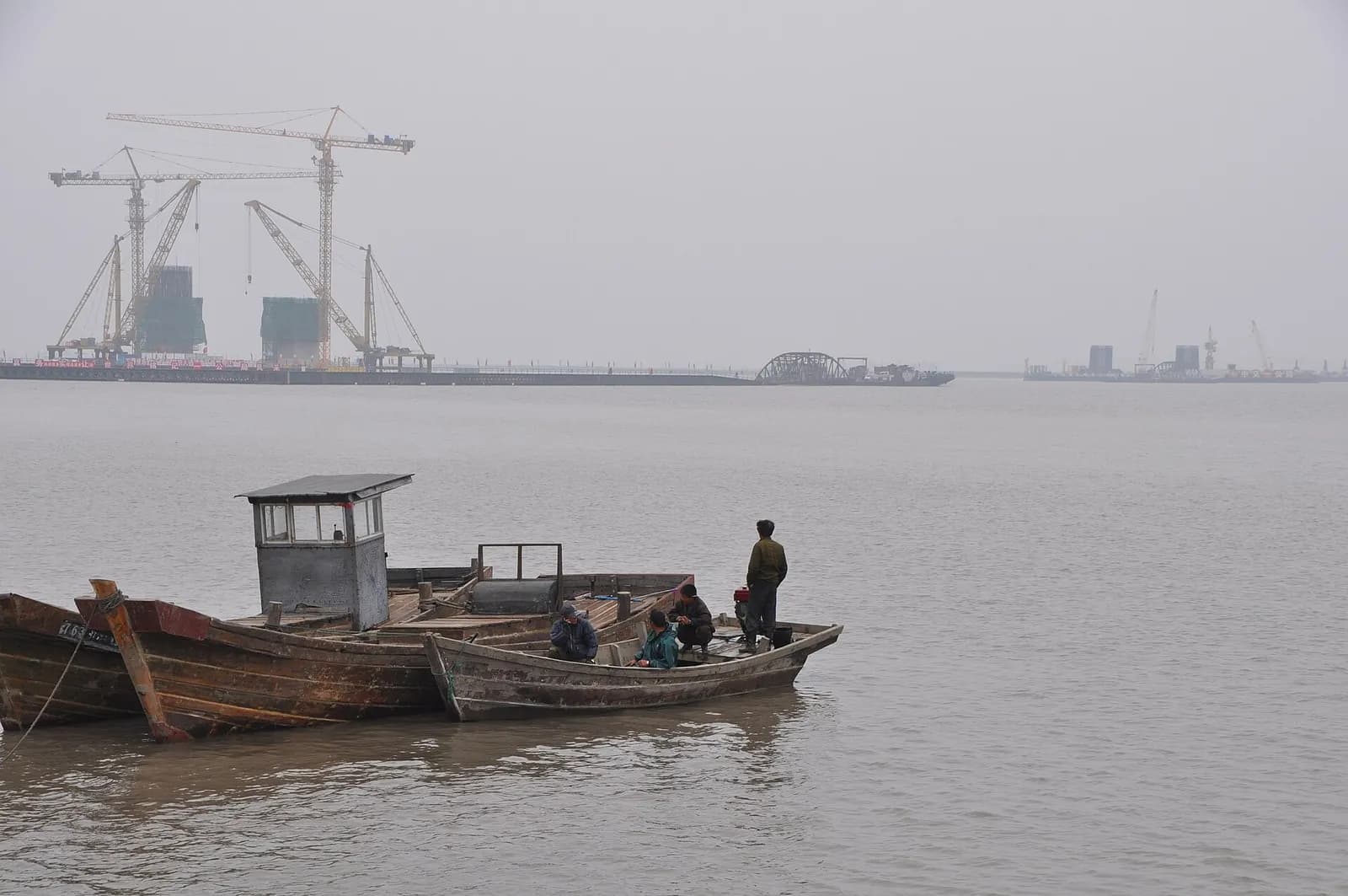 The New Yalu River Bridge under construction, with the China side to the left and the Korea side in the distance.