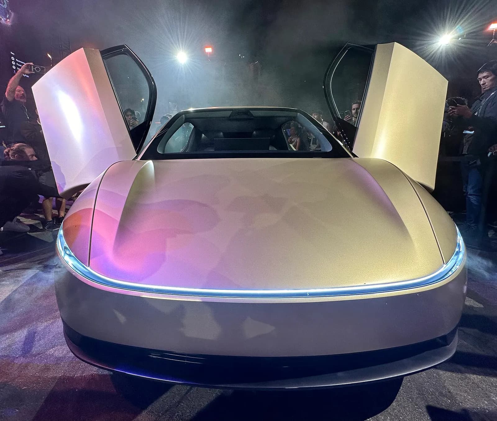 Front view of a Tesla Cybercab concept car at its unveiling.