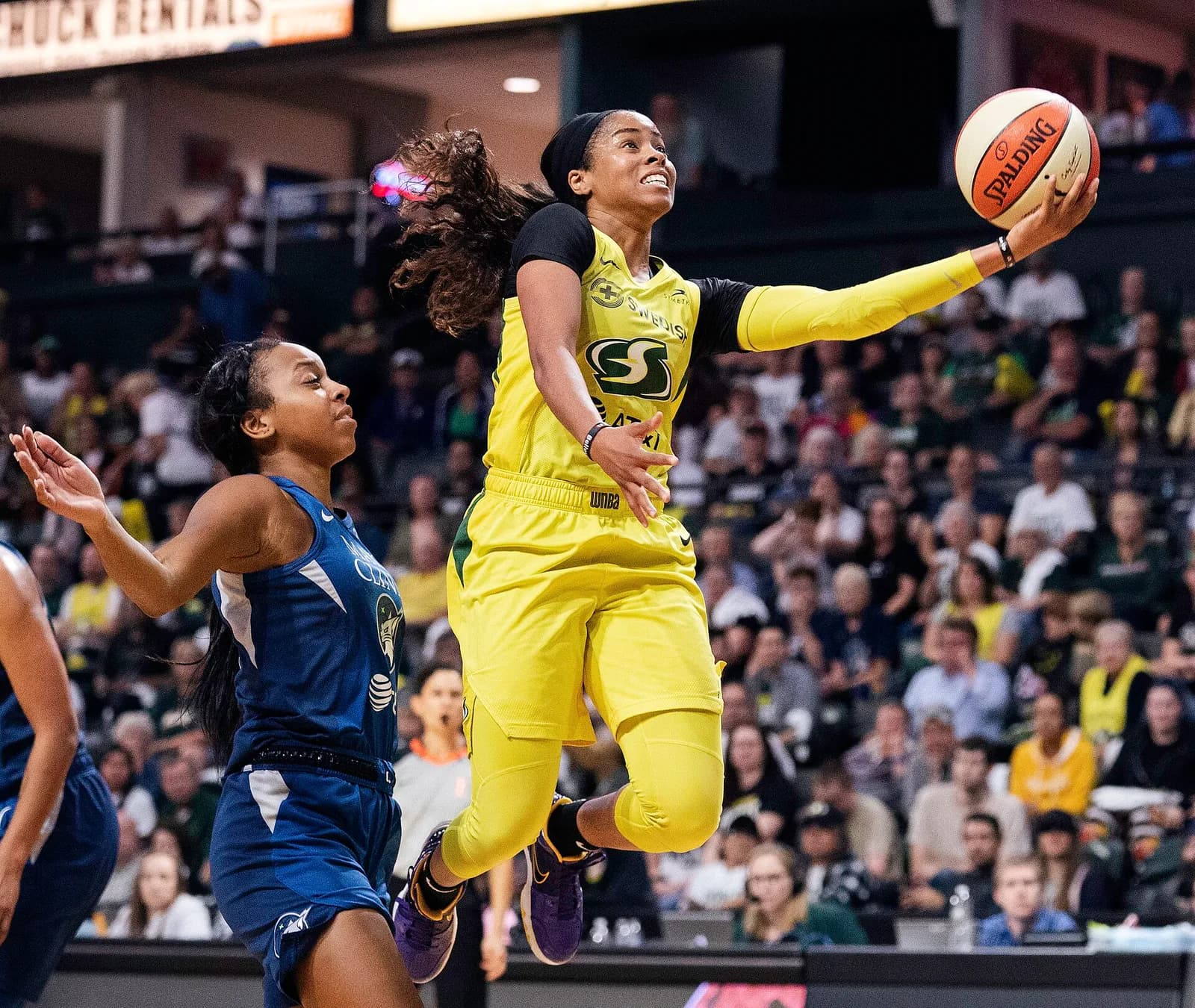 Jordin Canada takes a shot during a WNBA playoff game for the Seattle Storm.