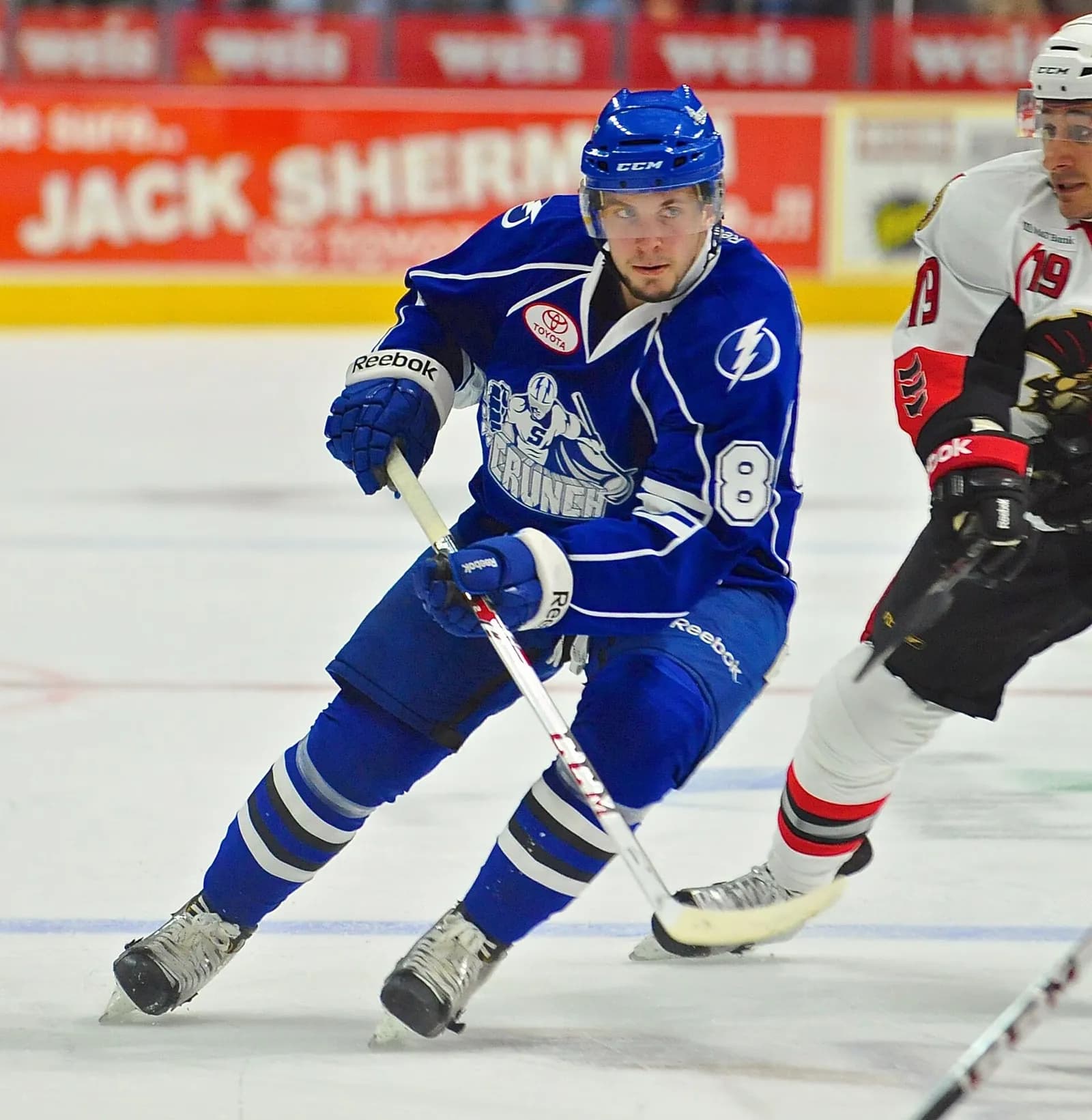 Nikita Kucherov skates with the puck for the Syracuse Crunch in an AHL game.