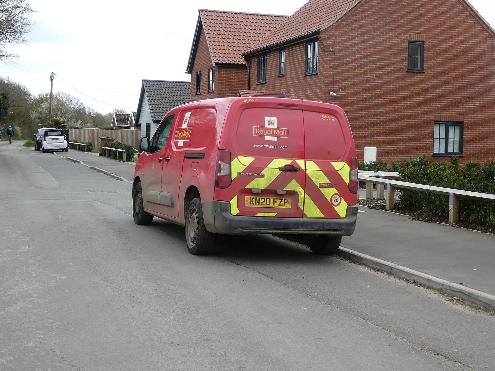 A Royal Mail van on a road in Wymondham, Norfolk.
