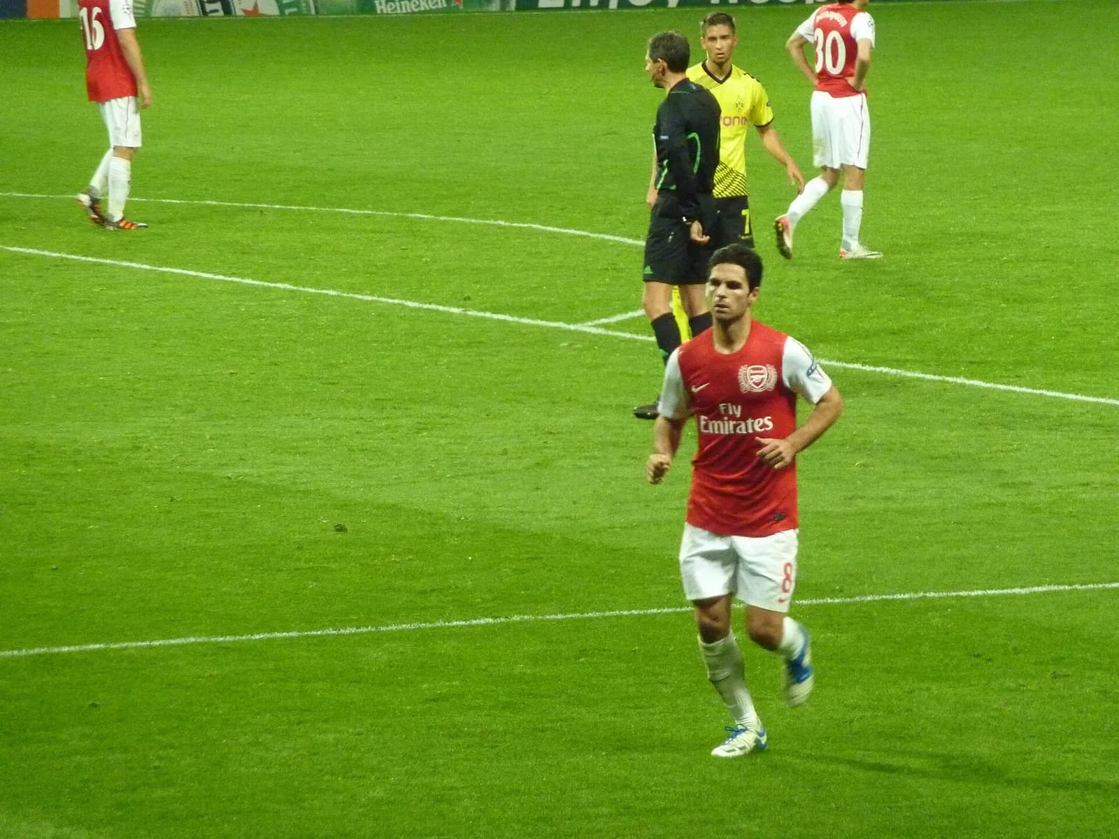 Mikel Arteta playing for Arsenal against Borussia Dortmund in 2011.