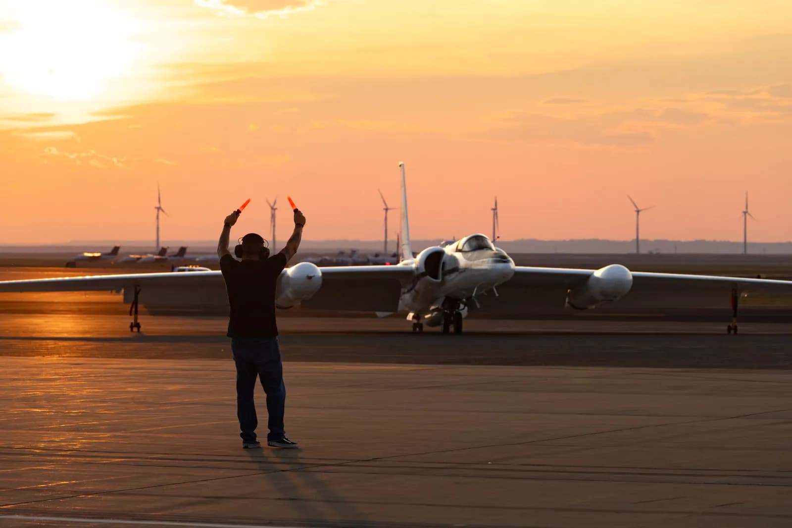 NASA ER-2 aircraft taxiing on a runway during the INSPYRE campaign