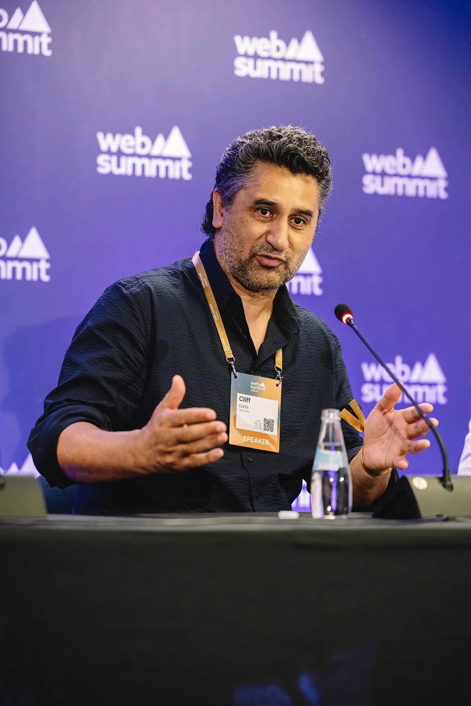 Actor Cliff Curtis speaking at a press conference with Bloxx co-founder and CEO Chris Smith.