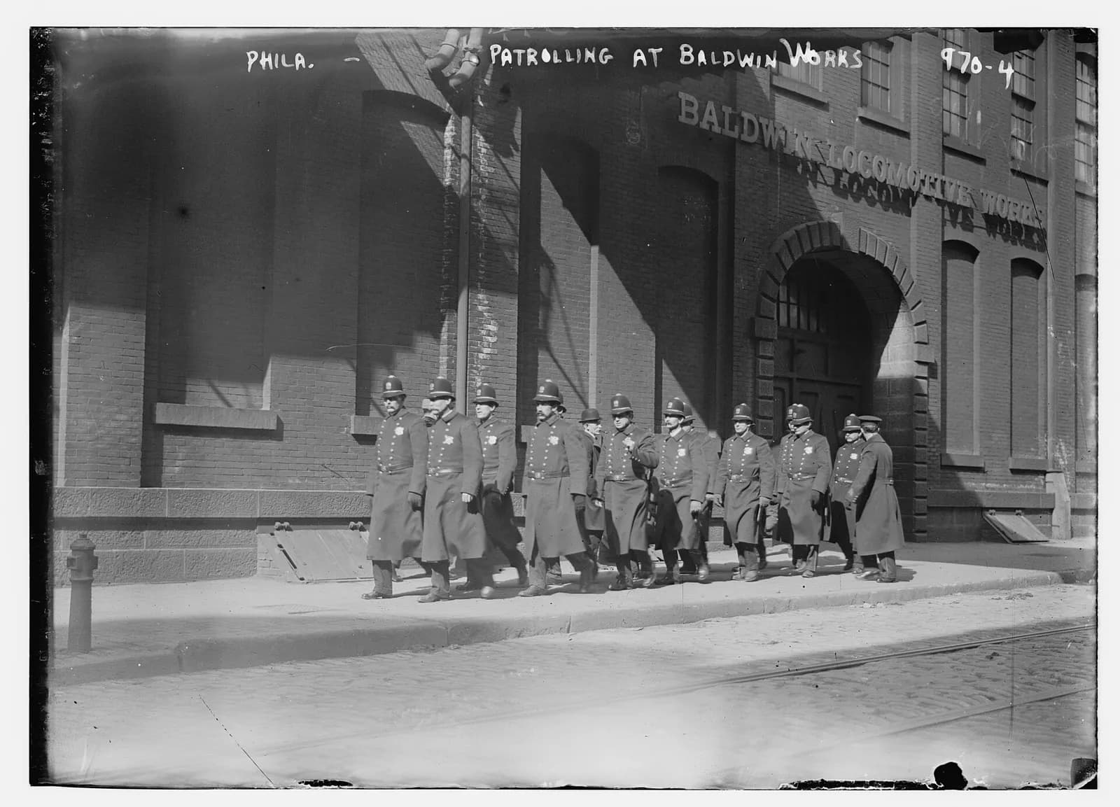 A police patrol marches outside the Baldwin Locomotive Works in Philadelphia.