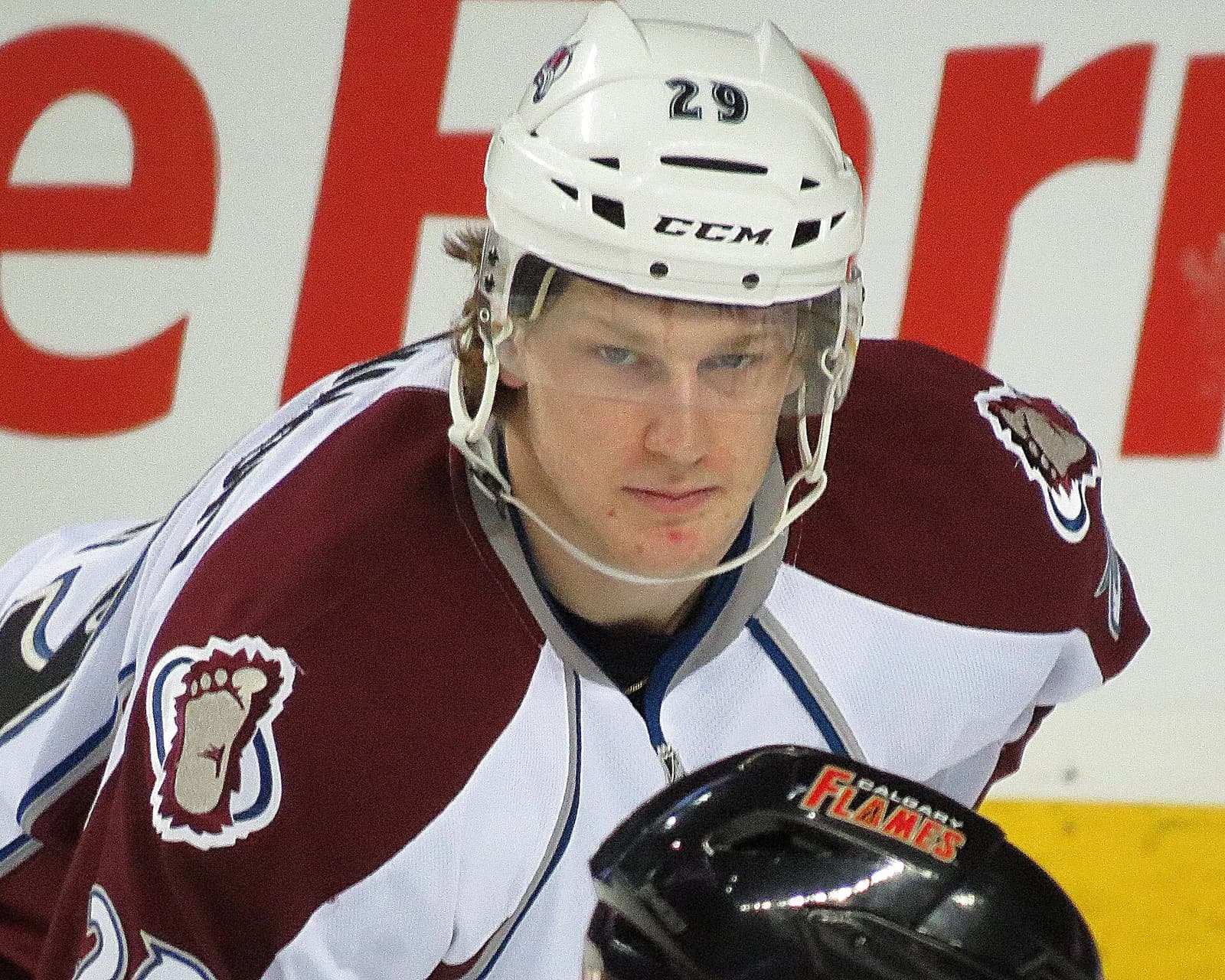 Nathan MacKinnon playing for the Colorado Avalanche during a game against the Calgary Flames.
