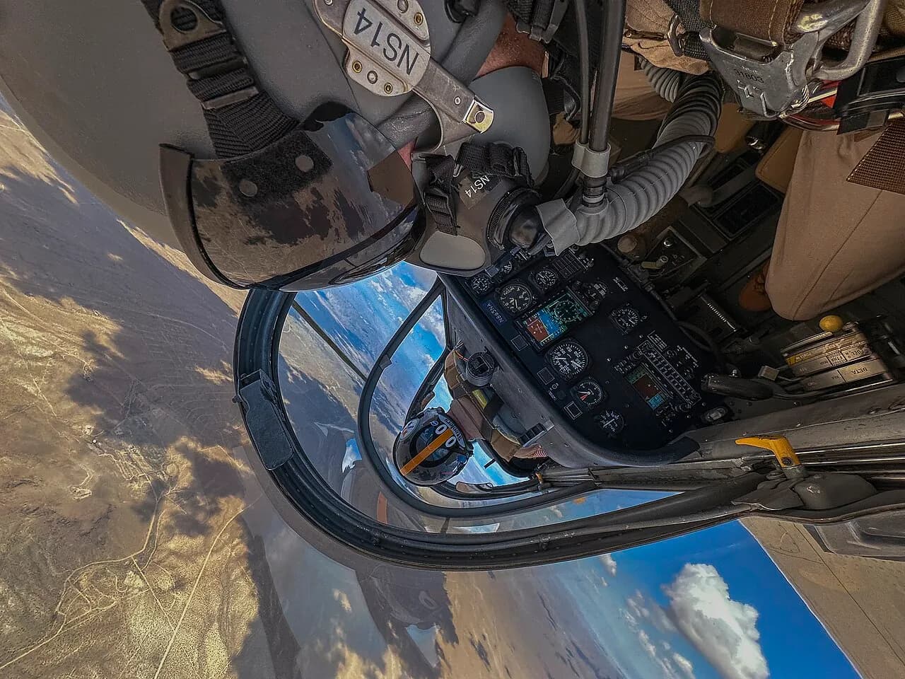 NASA Armstrong T-34C aircraft flying above the ground during a proficiency flight