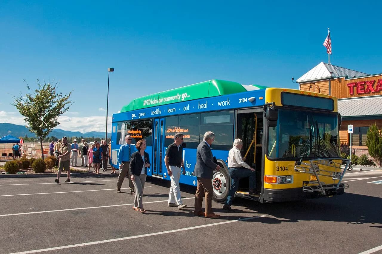 People boarding a Rogue Valley Transit District bus during a 2016 Oregon road project tour