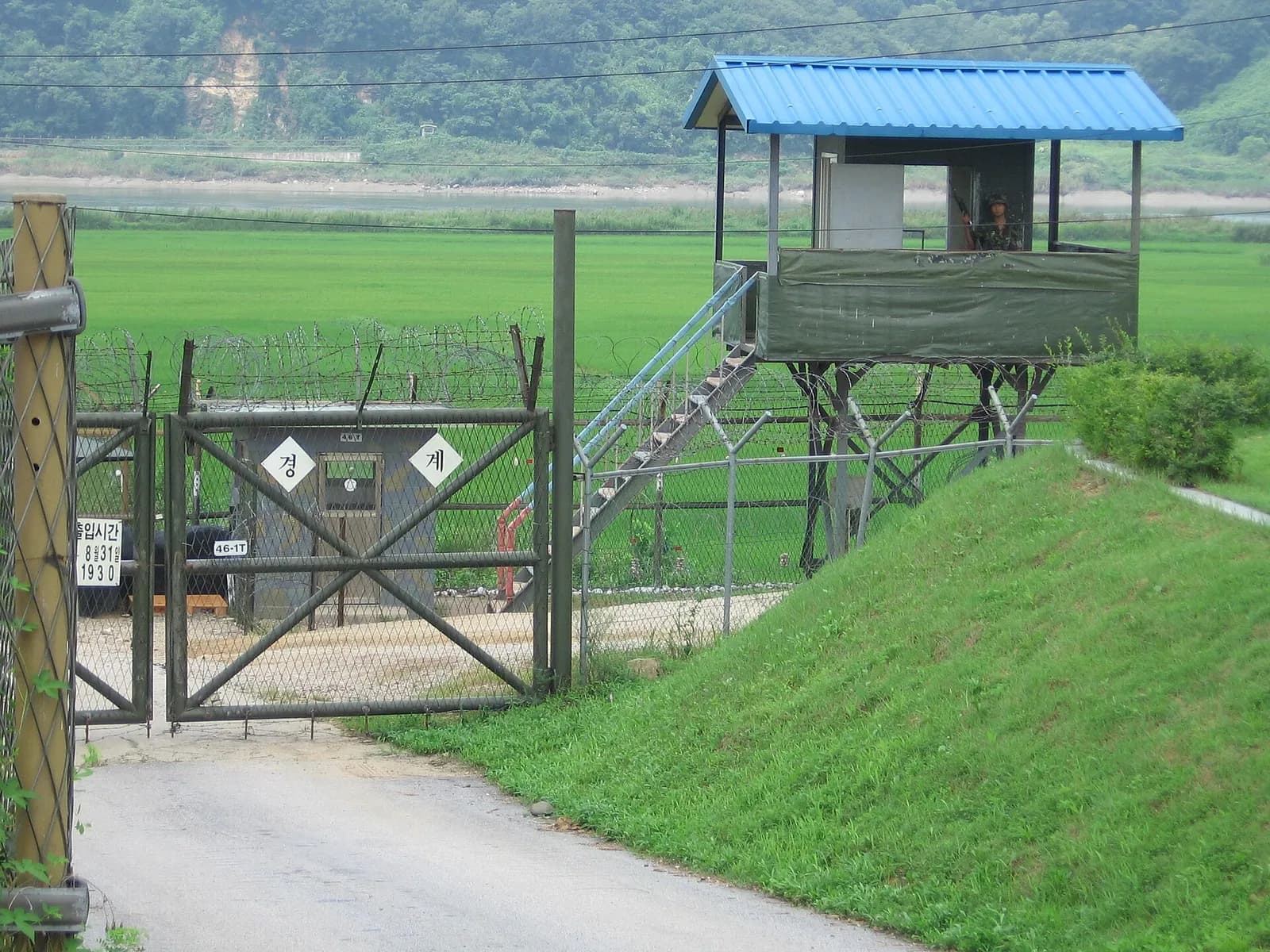 A South Korean sentry at a fenced post near the demilitarized zone at Imjingang.