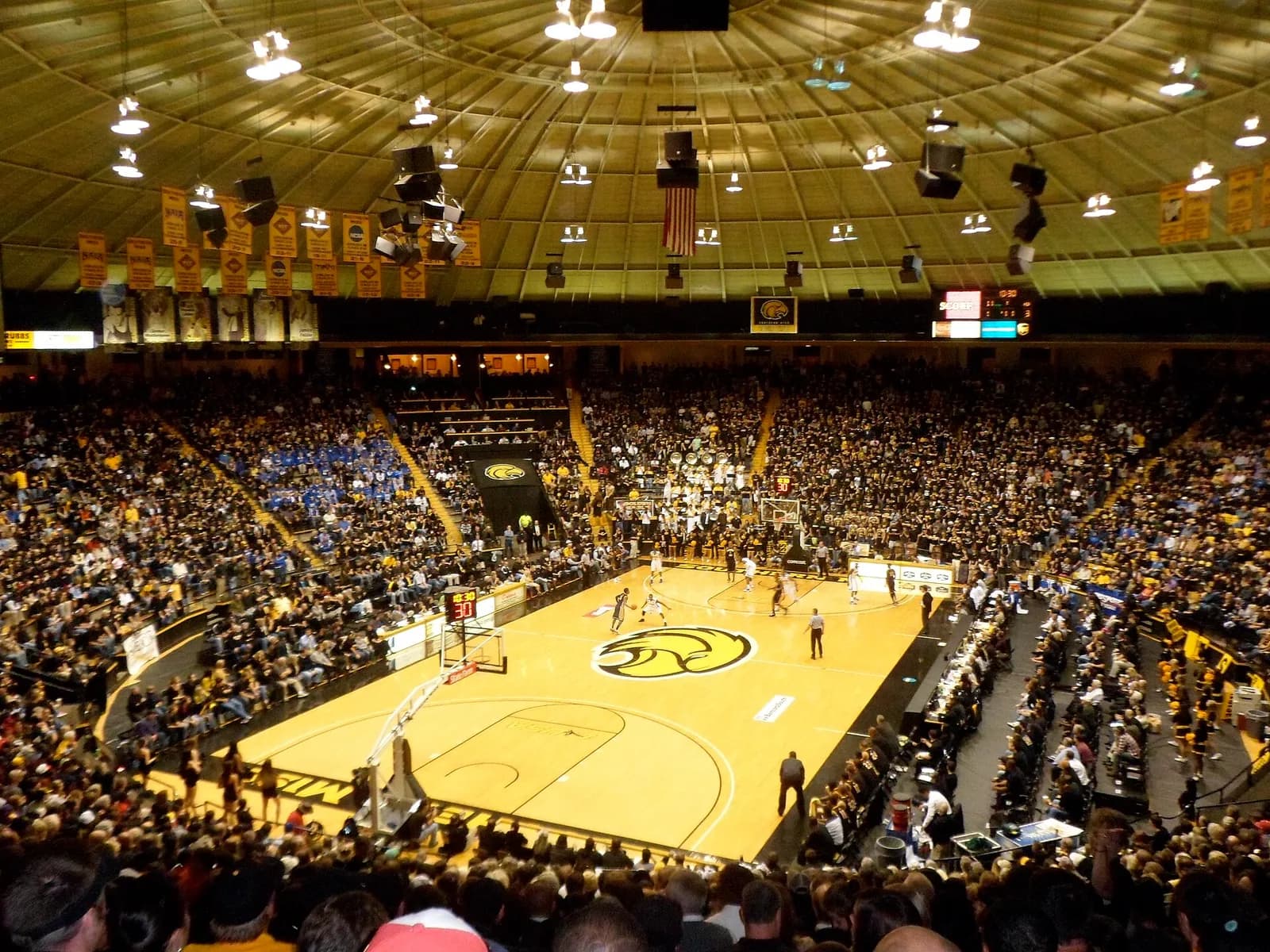 Basketball game underway inside Reed Green Coliseum in Hattiesburg, Mississippi.