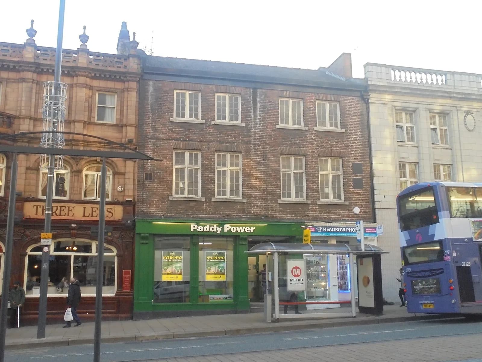 Paddy Power storefront beside a phone shop on the Headrow in Leeds.