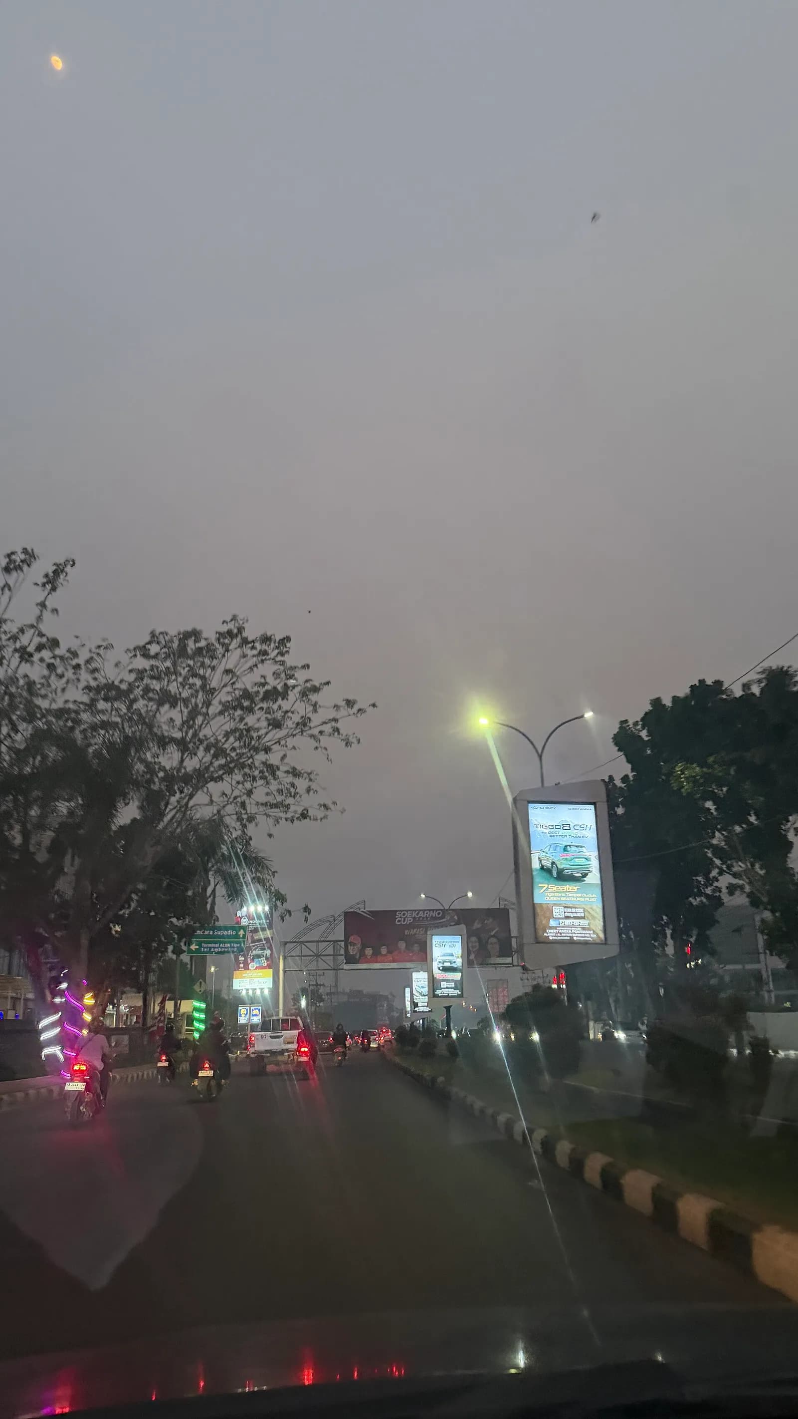 A street in Pontianak is obscured by haze.