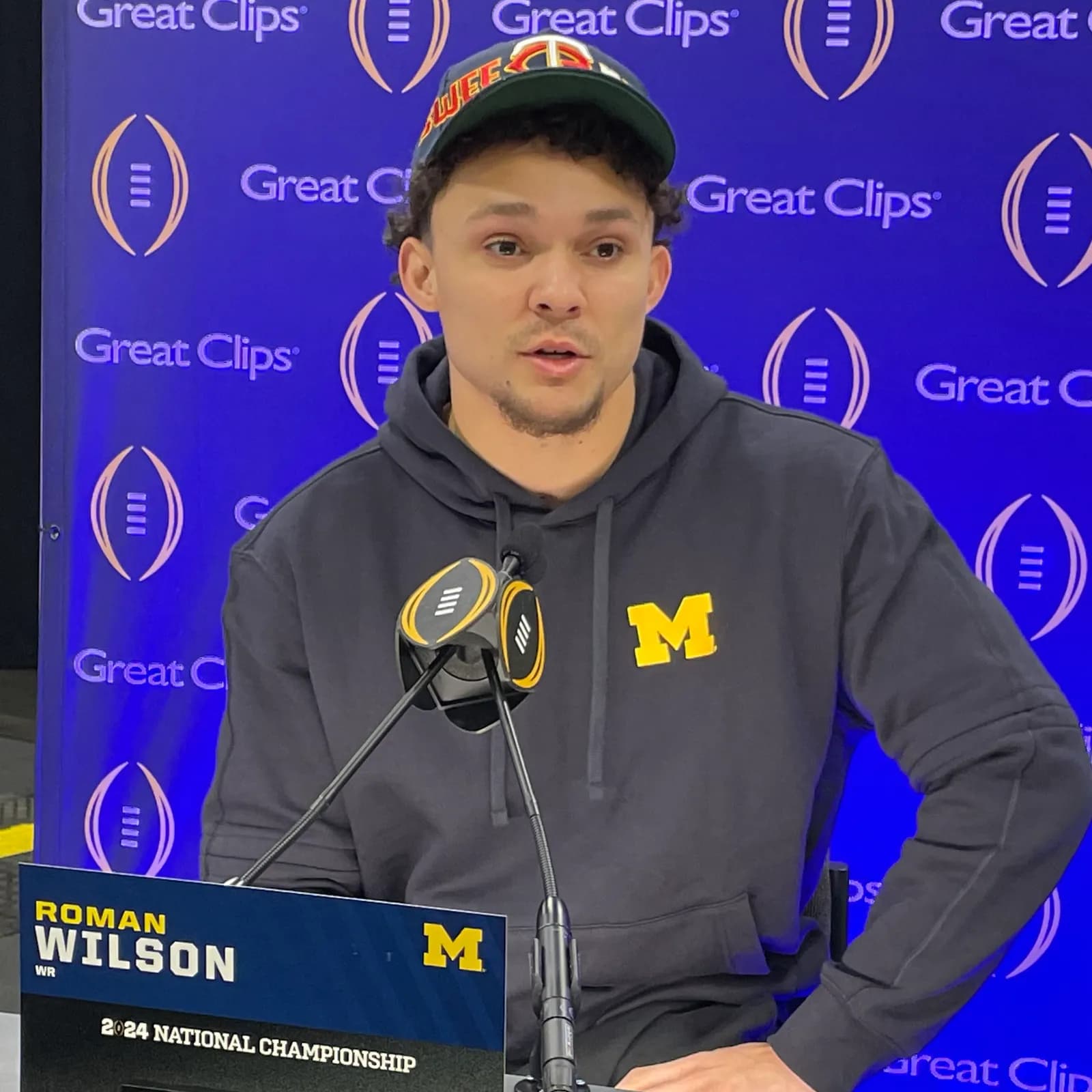 Roman Wilson seated at a media day press conference in Houston in January 2024