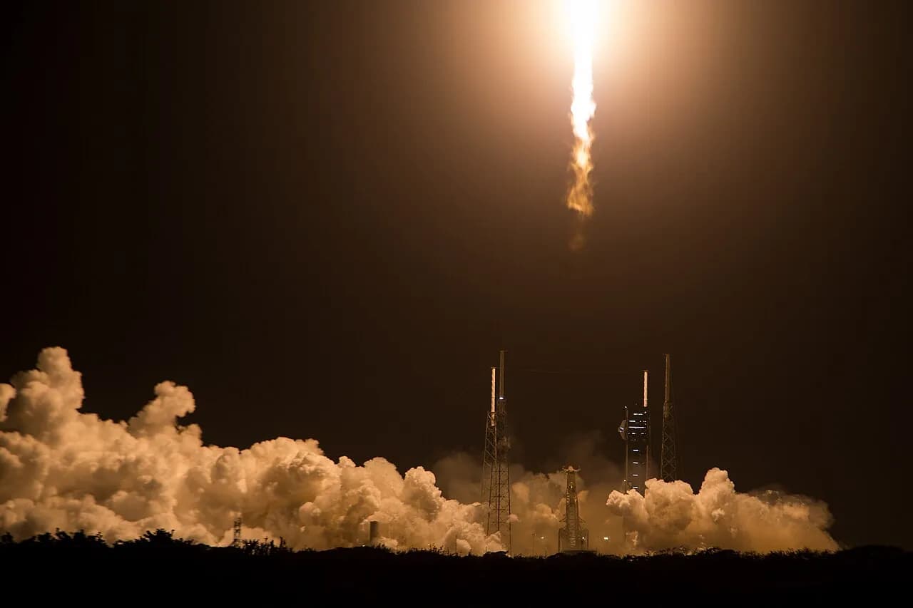 Falcon 9 rocket lifting off from Cape Canaveral during the earlier Crew-12 mission