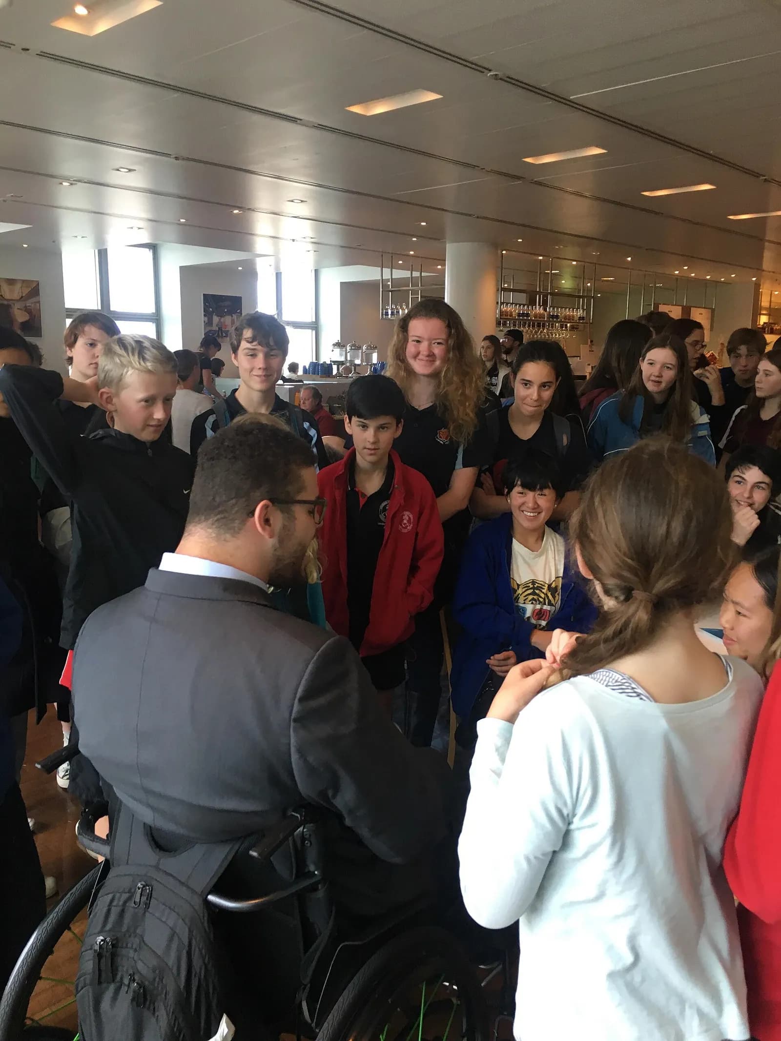 Senator Jordon Steele-John meets with young climate strikers outside Parliament House in Canberra.