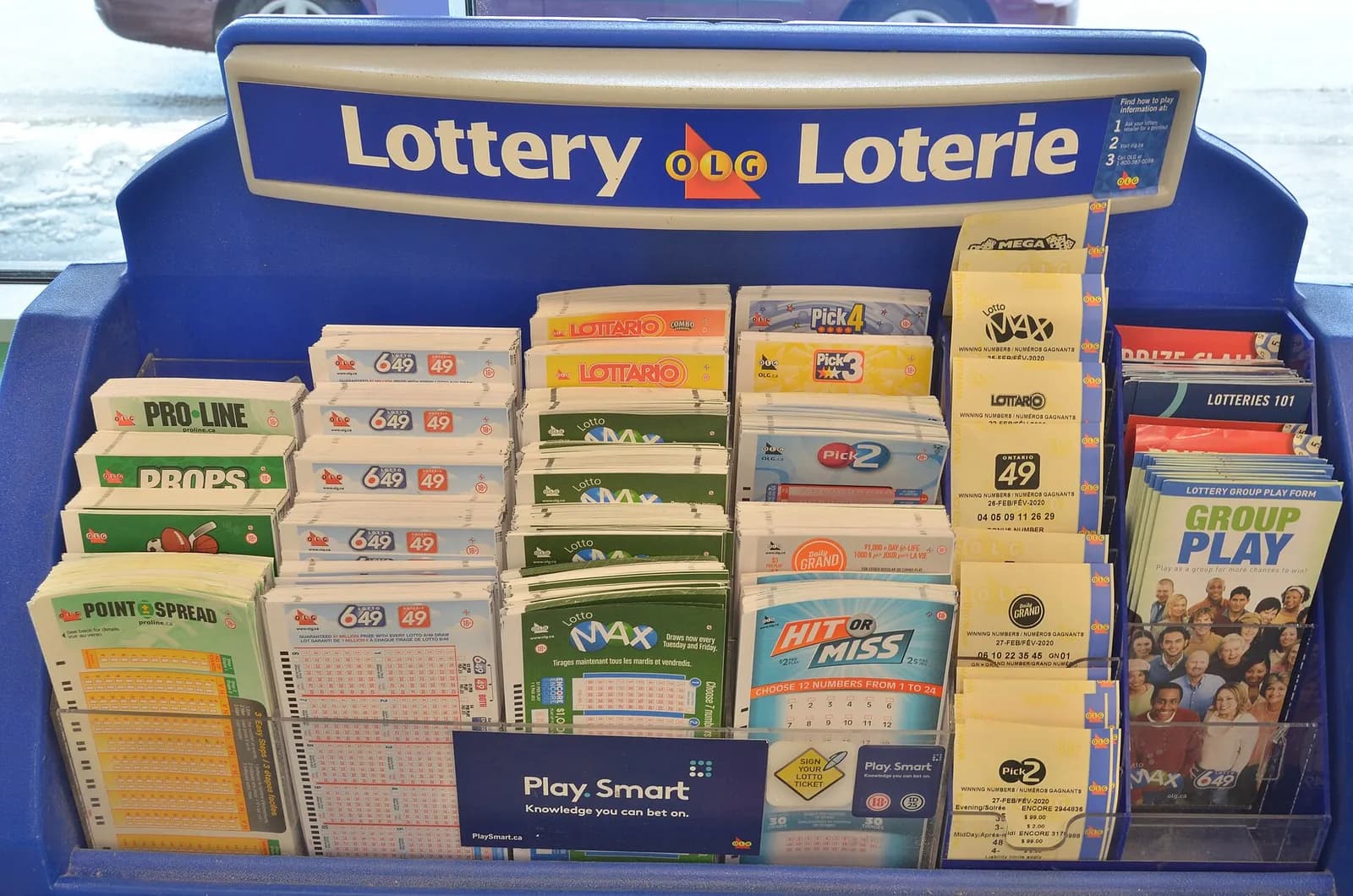 Ontario lottery tickets, including Lotto Max tickets, photographed together.