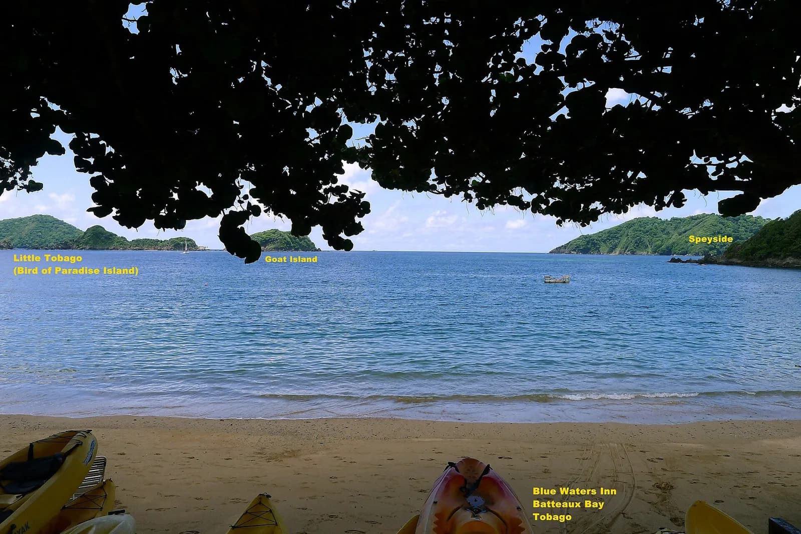 Beach and sea near Speyside, Tobago, with islands in the distance.