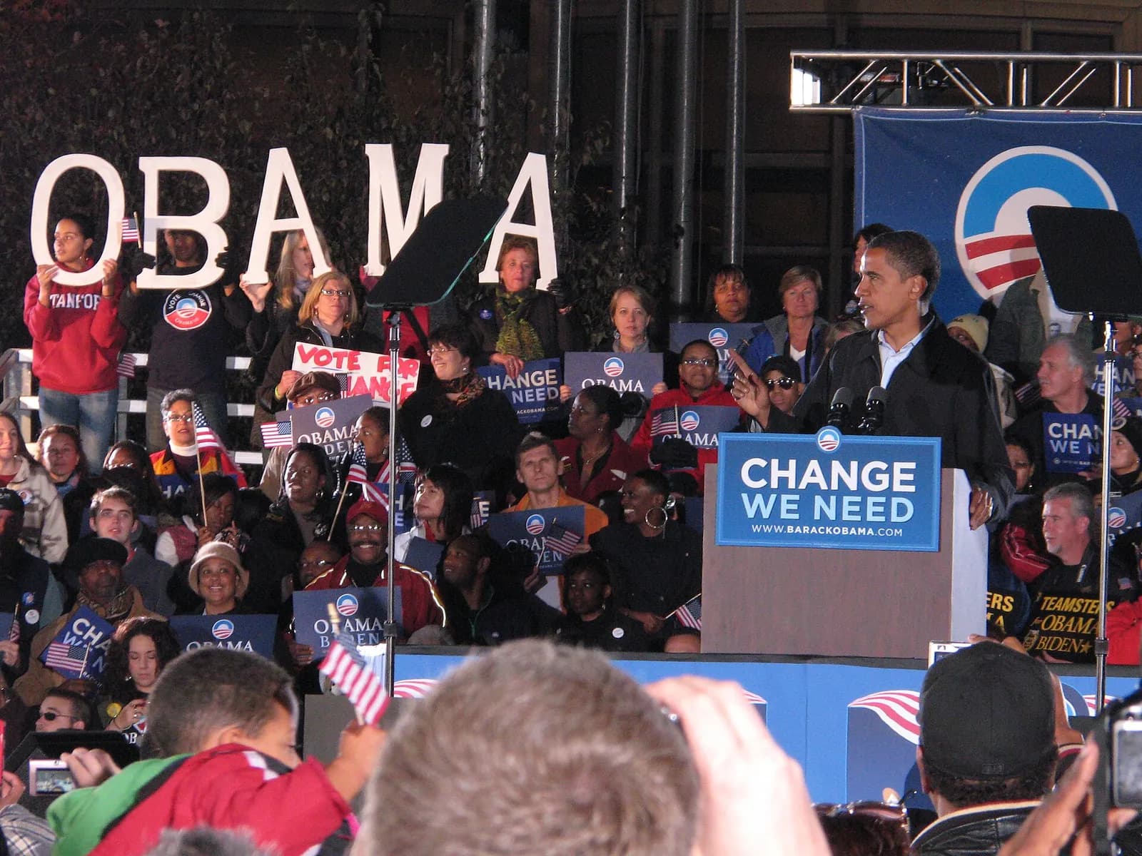 Barack Obama speaks at a rally in Cleveland, with supporters visible in the background.