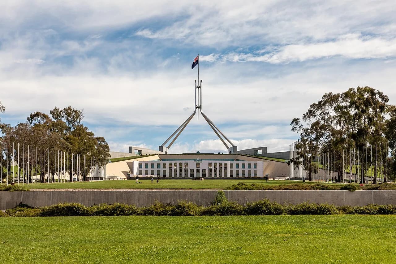 Parliament House in Canberra under a blue sky