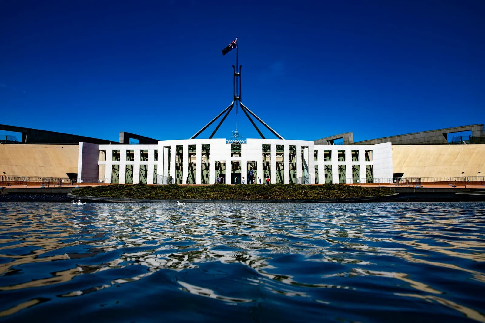 Australian Parliament House in Canberra with the Australian flag flying above it