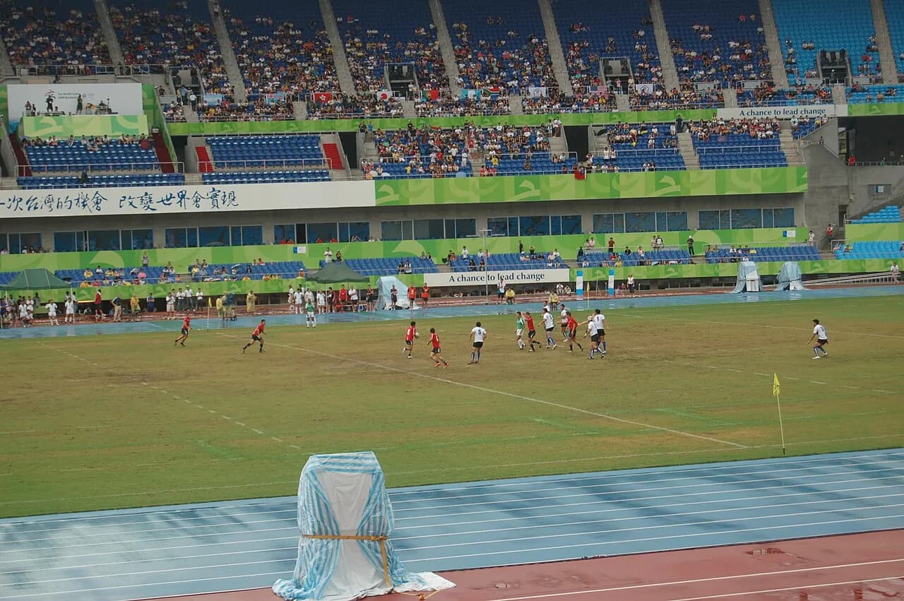 Hong Kong and Taiwan rugby sevens players compete on a field in Kaohsiung in 2009