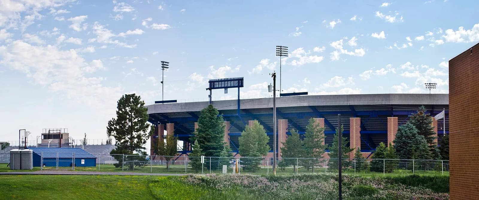 Rear view of Bobcat Stadium and nearby track and field grandstands in Bozeman, Montana.