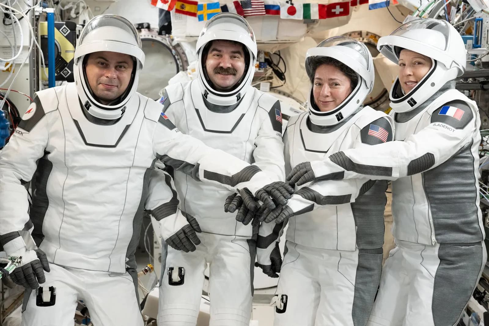 Crew-12 members Andrey Fedyaev, Jack Hathaway, Jessica Meir and Sophie Adenot pose in Dragon pressure suits aboard the space station.