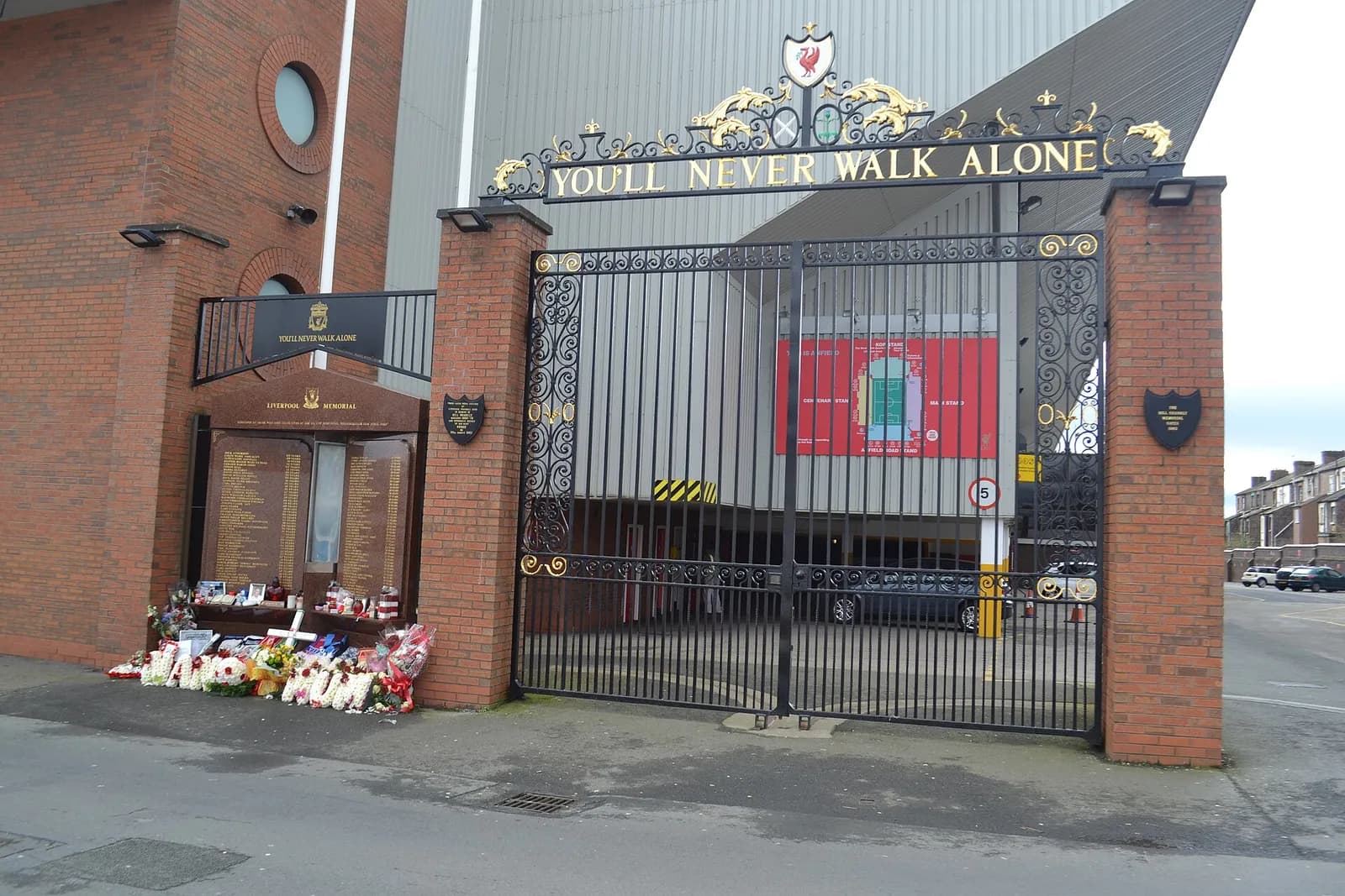 The Hillsborough Memorial at Anfield, with flowers laid beside the gates.