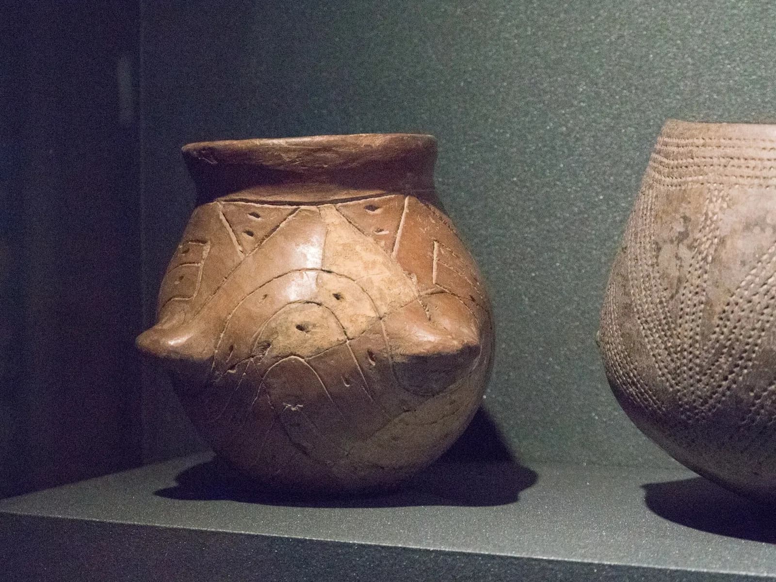 A decorated Neolithic Linear Pottery culture vessel displayed against a plain background.
