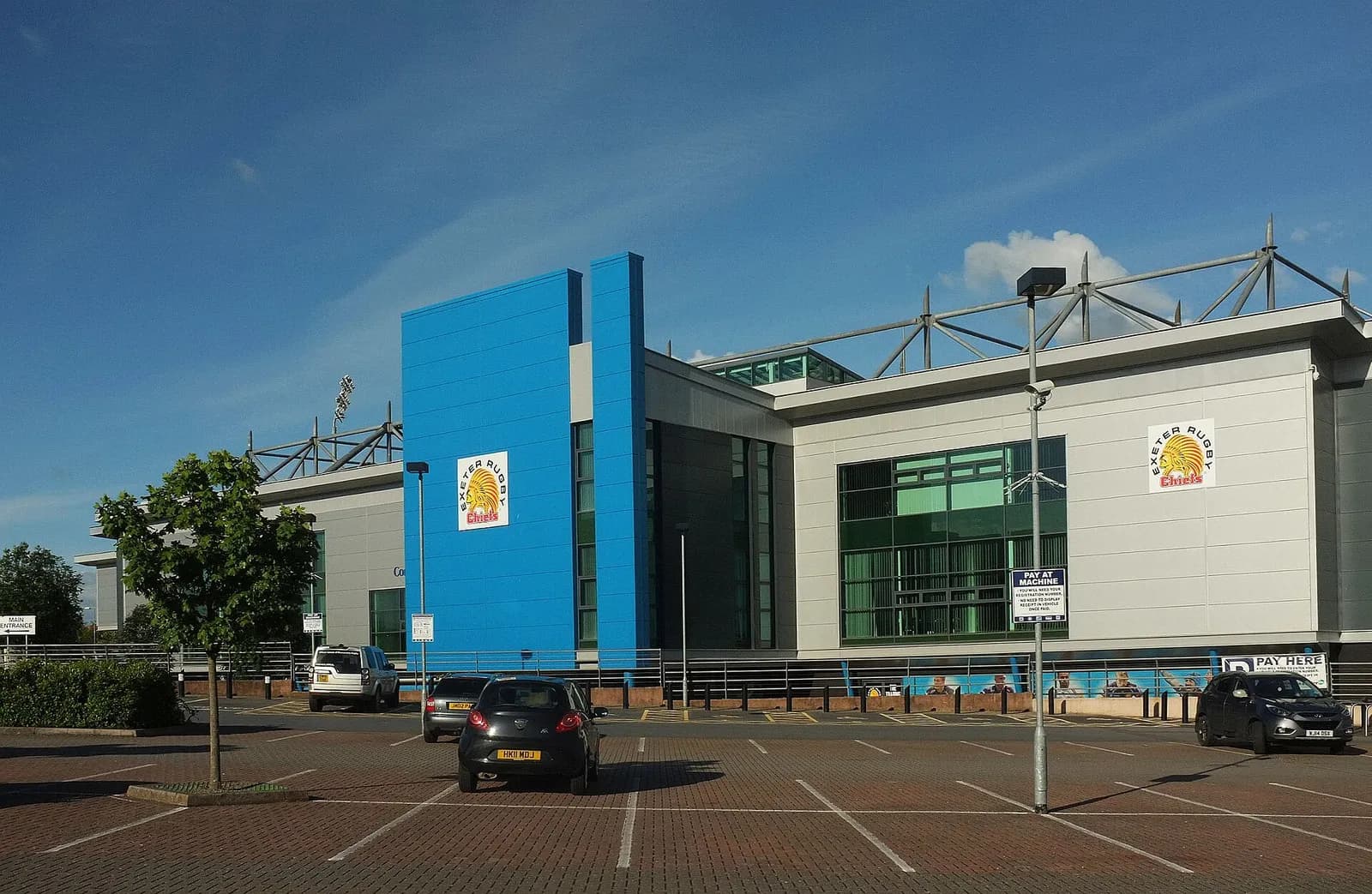 View of Exeter Chiefs’ Sandy Park stadium and a parking area in Exeter.