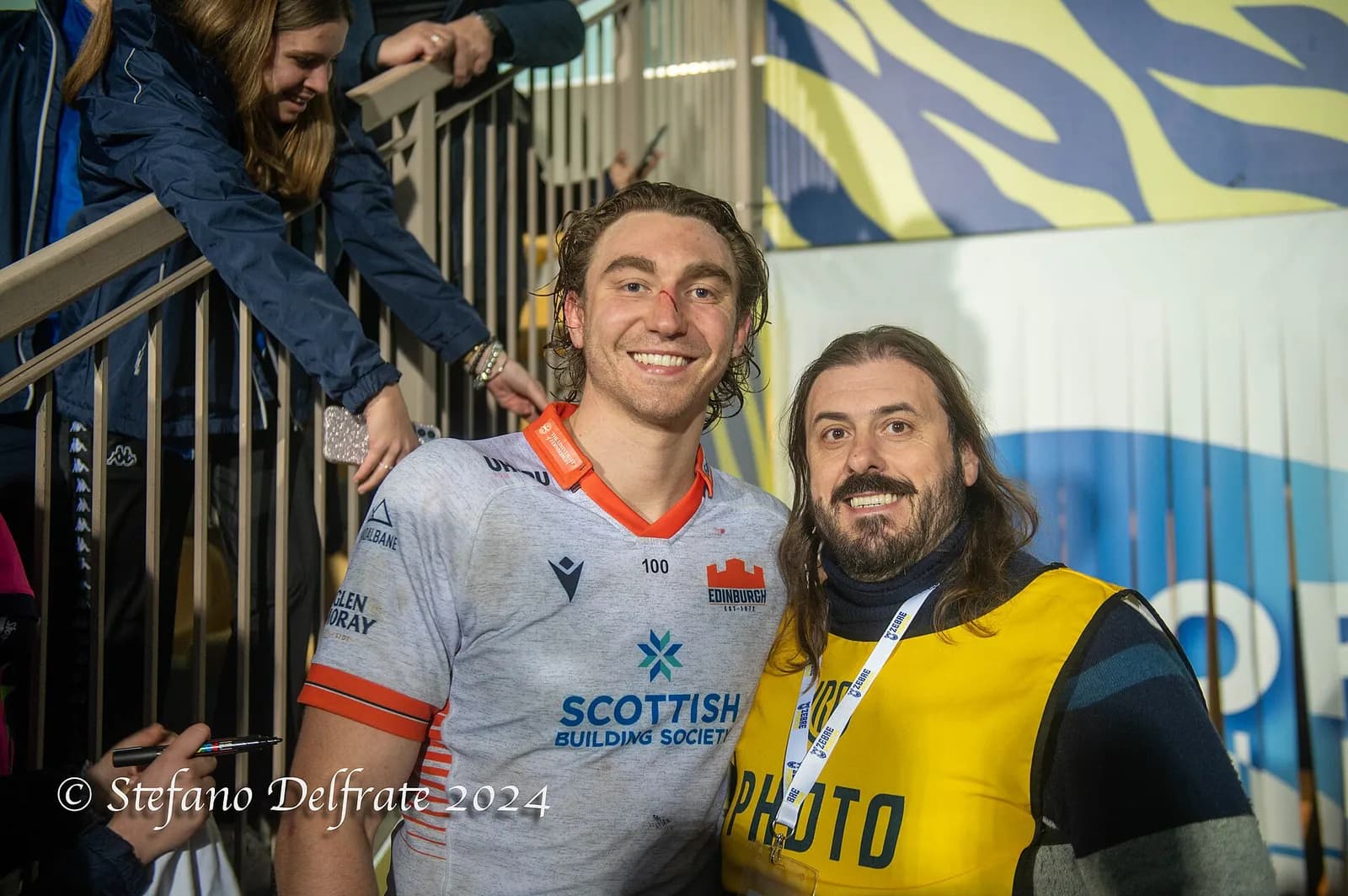 Jamie Ritchie poses beside a photographer at an Edinburgh Rugby match.