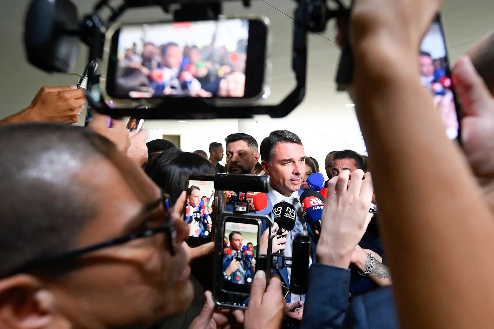 Flávio Bolsonaro speaks to reporters during an interview at the Brazilian Senate in Brasília.