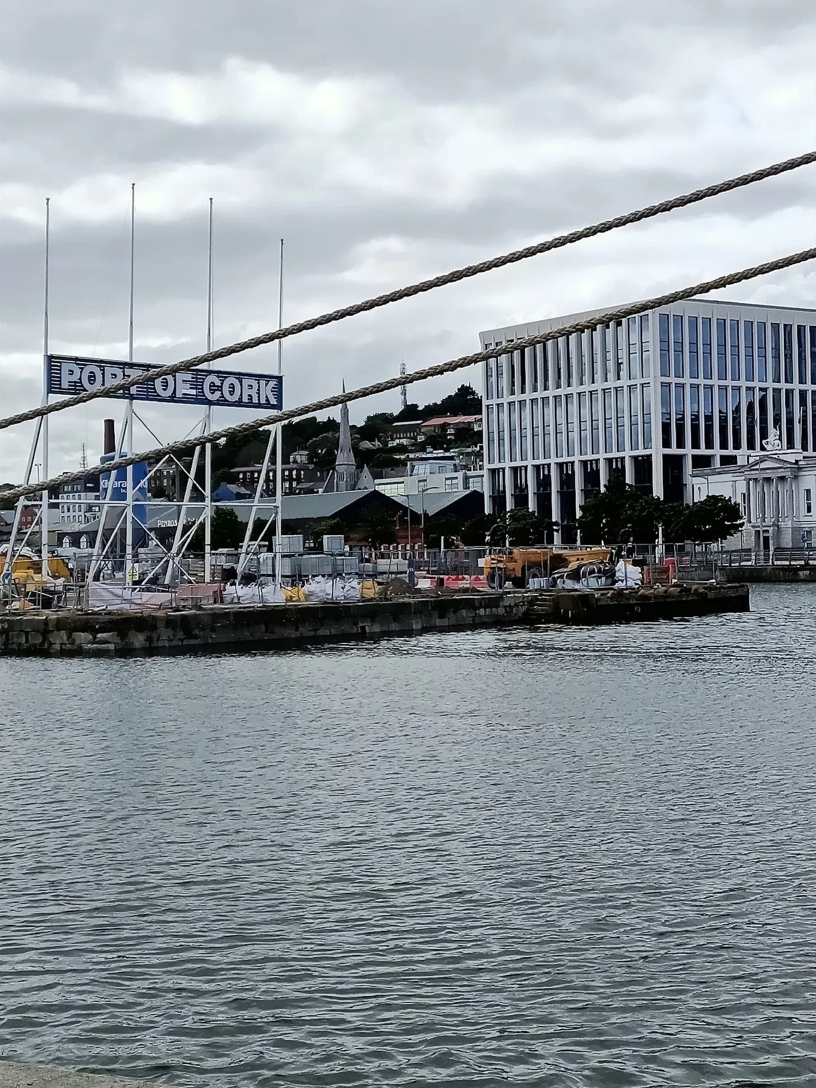 View of the Port of Cork with buildings in Cork City behind the waterfront.