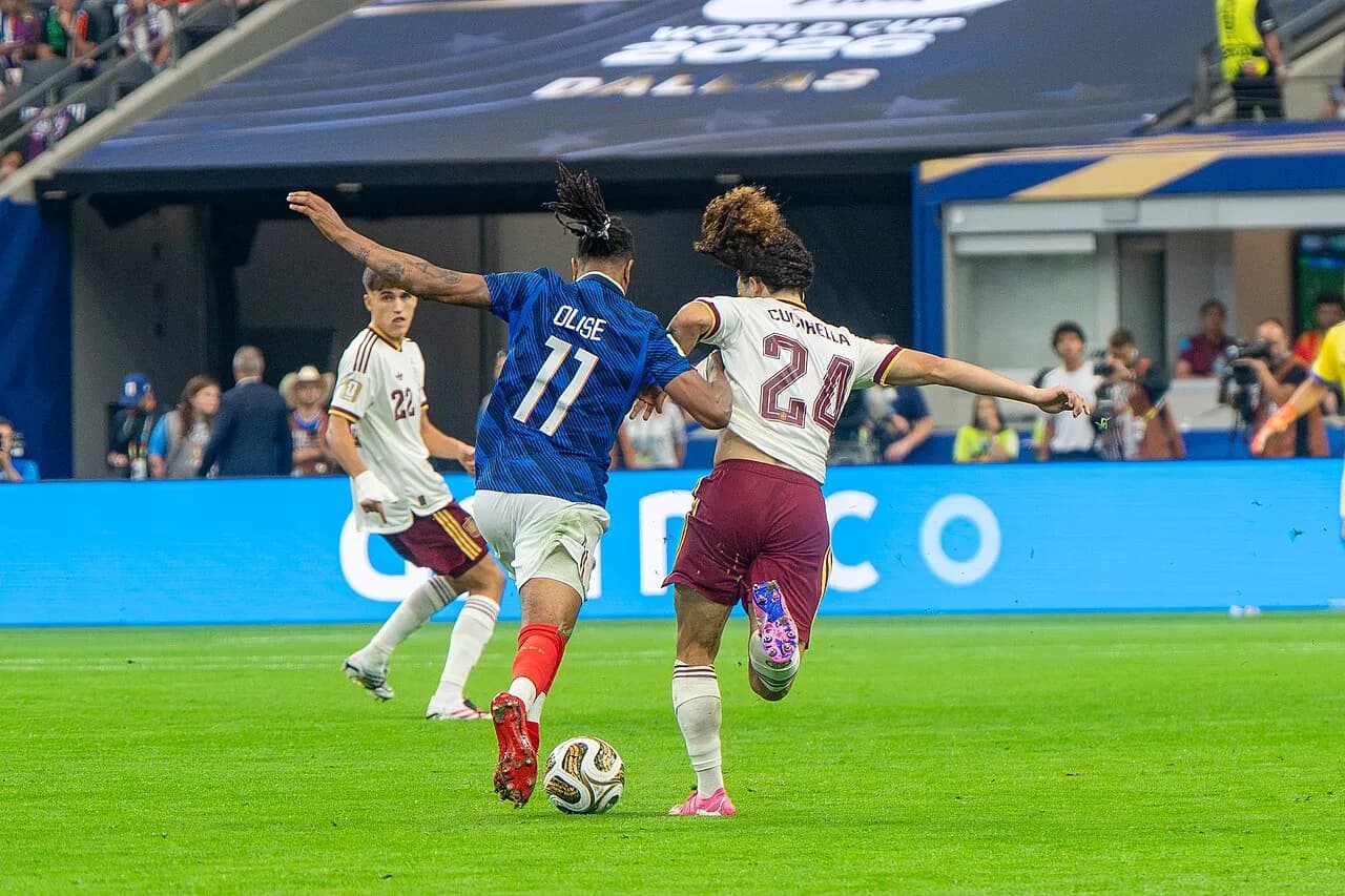 Michael Olise and Marc Cucurella during a France–Spain football match
