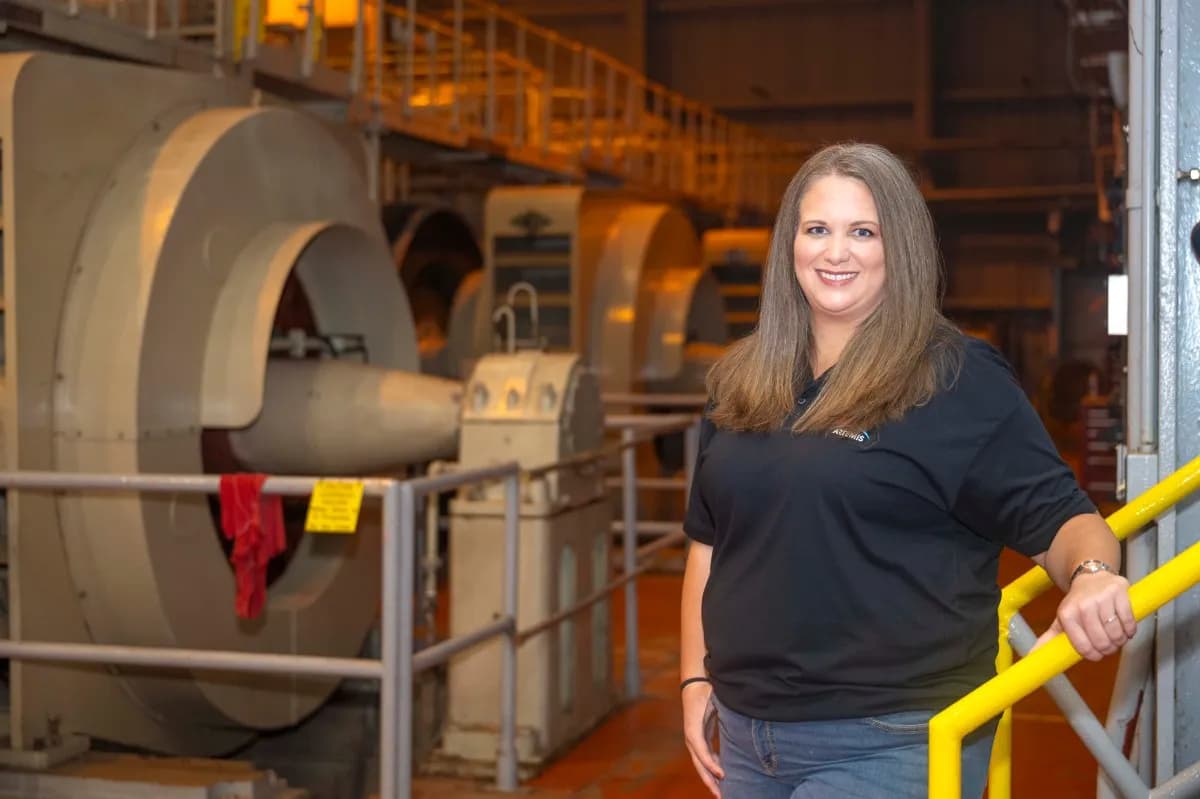 Kristie Foster stands inside the High Pressure Industrial Water Facility at NASA’s Stennis Space Center.