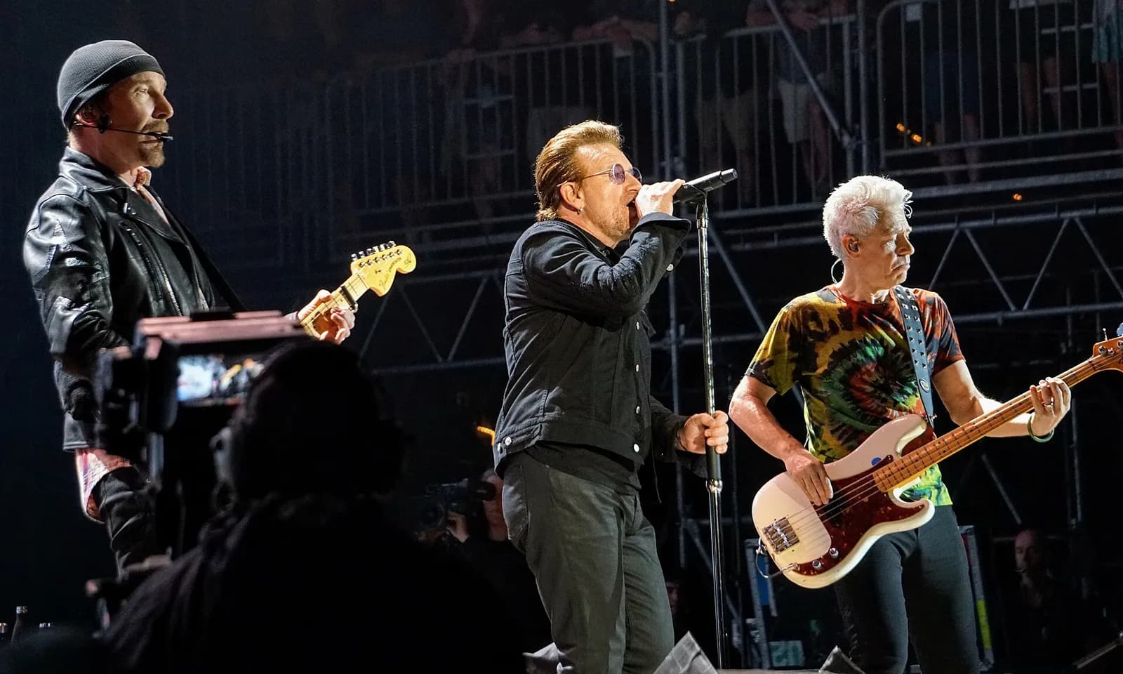 U2 performing on stage at the Bonnaroo Music Festival.