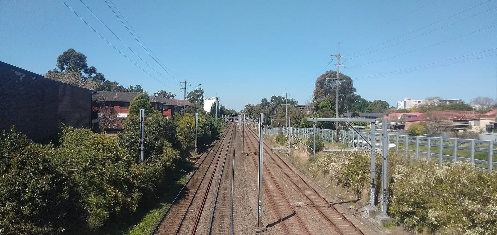 The Bankstown railway line and Botany Goods Line running through Marrickville, with Marrickville station visible in the distance.