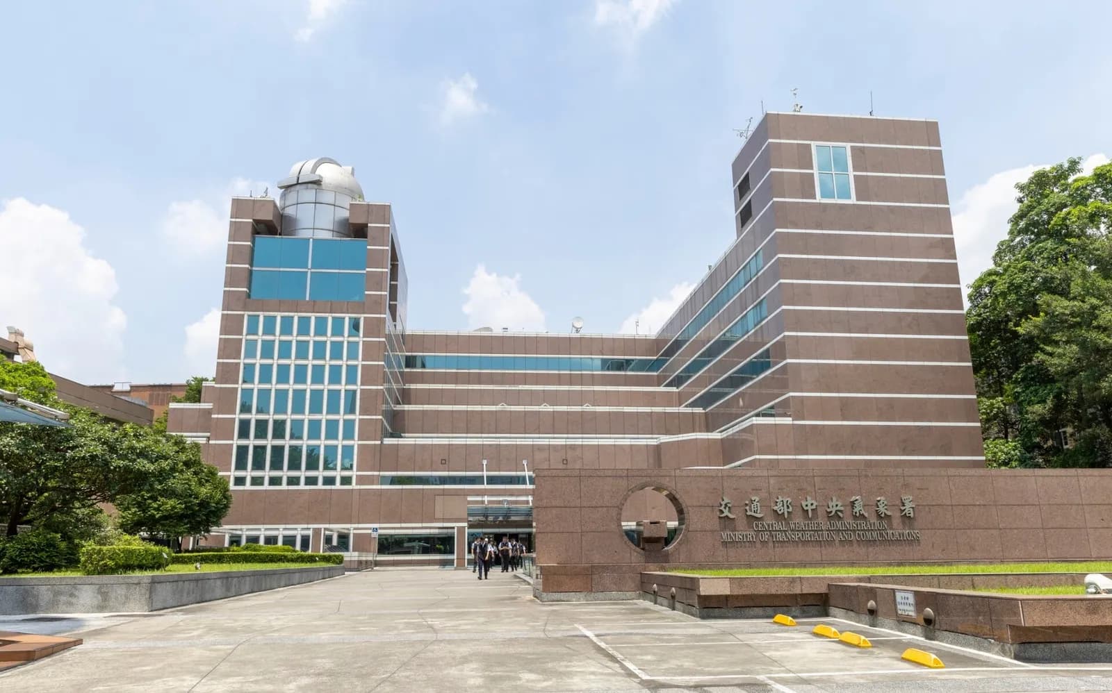 People leave Taiwan’s Central Weather Administration building after a visit by President Lai Ching-te.