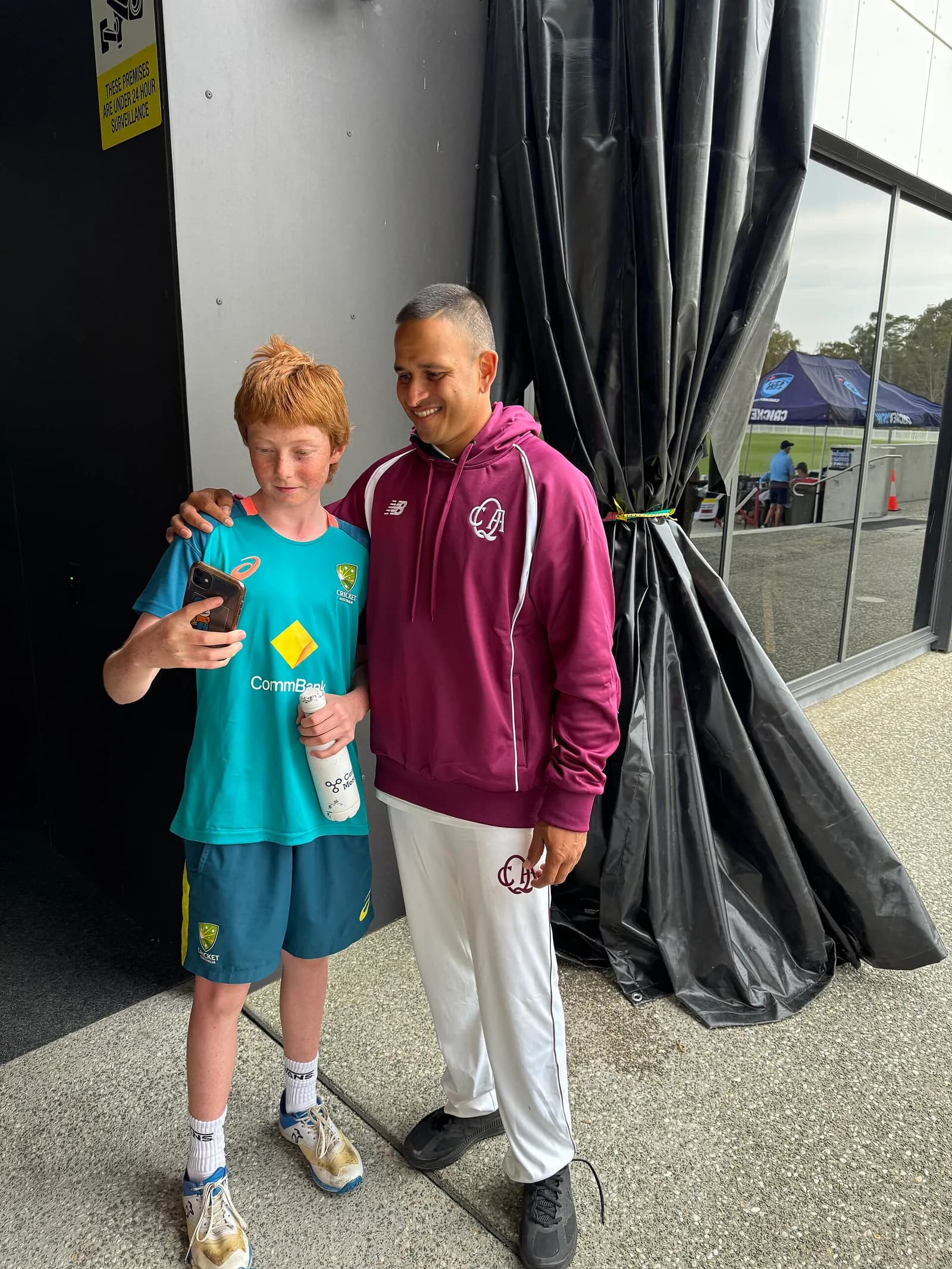 Usman Khawaja poses with a fan at Cricket Central.
