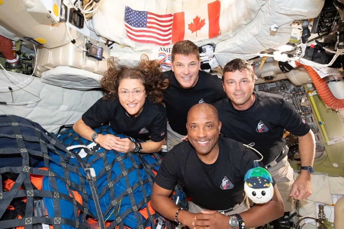 Artemis II astronauts Christina Koch, Jeremy Hansen, Reid Wiseman and Victor Glover pose inside the Orion spacecraft with their zero gravity indicator.