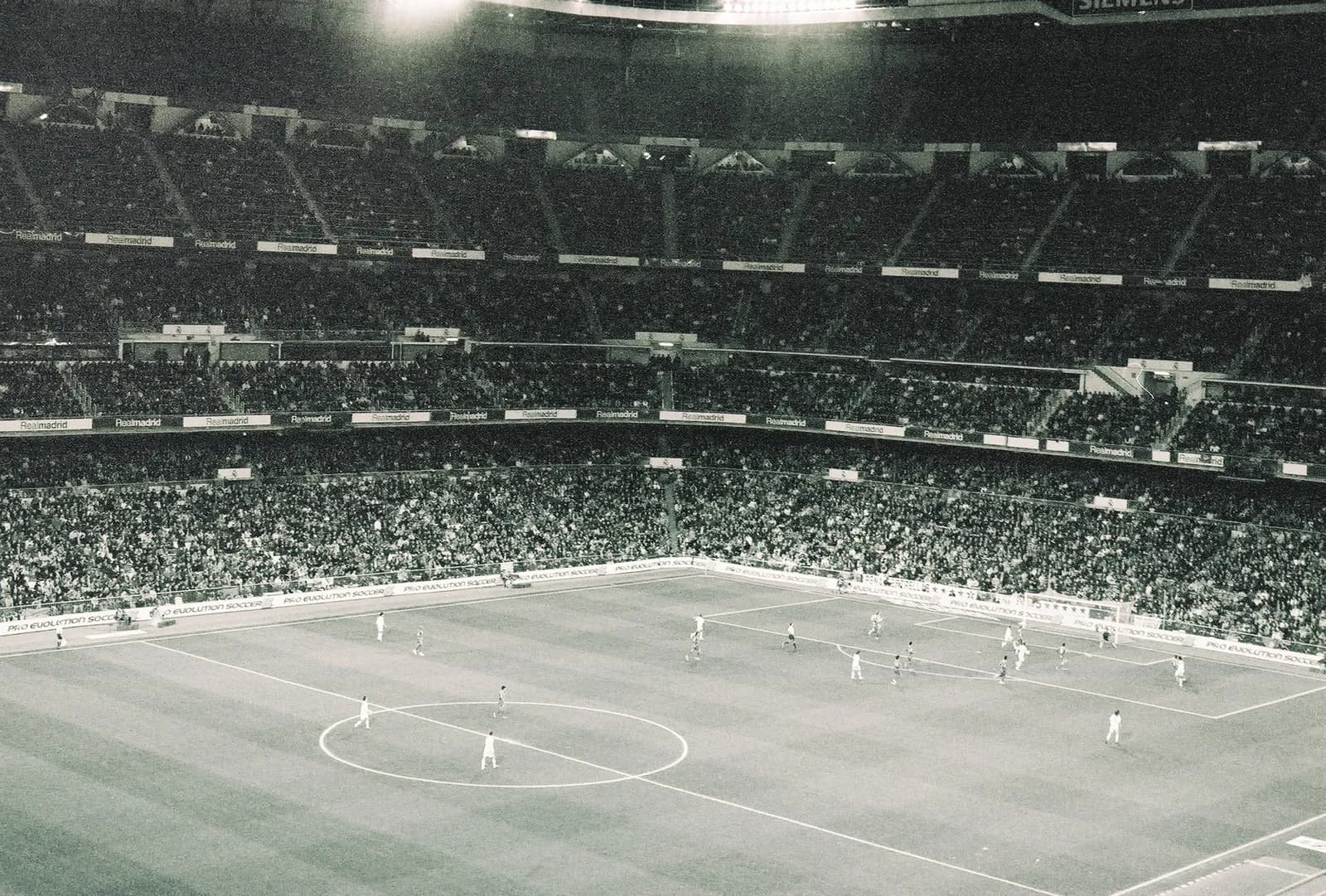 Real Madrid players on the pitch at Santiago Bernabéu Stadium in 2007.