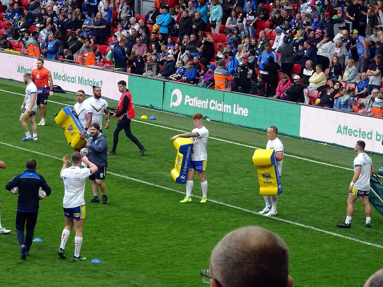 Warrington Wolves players warming up before a rugby league match in 2019