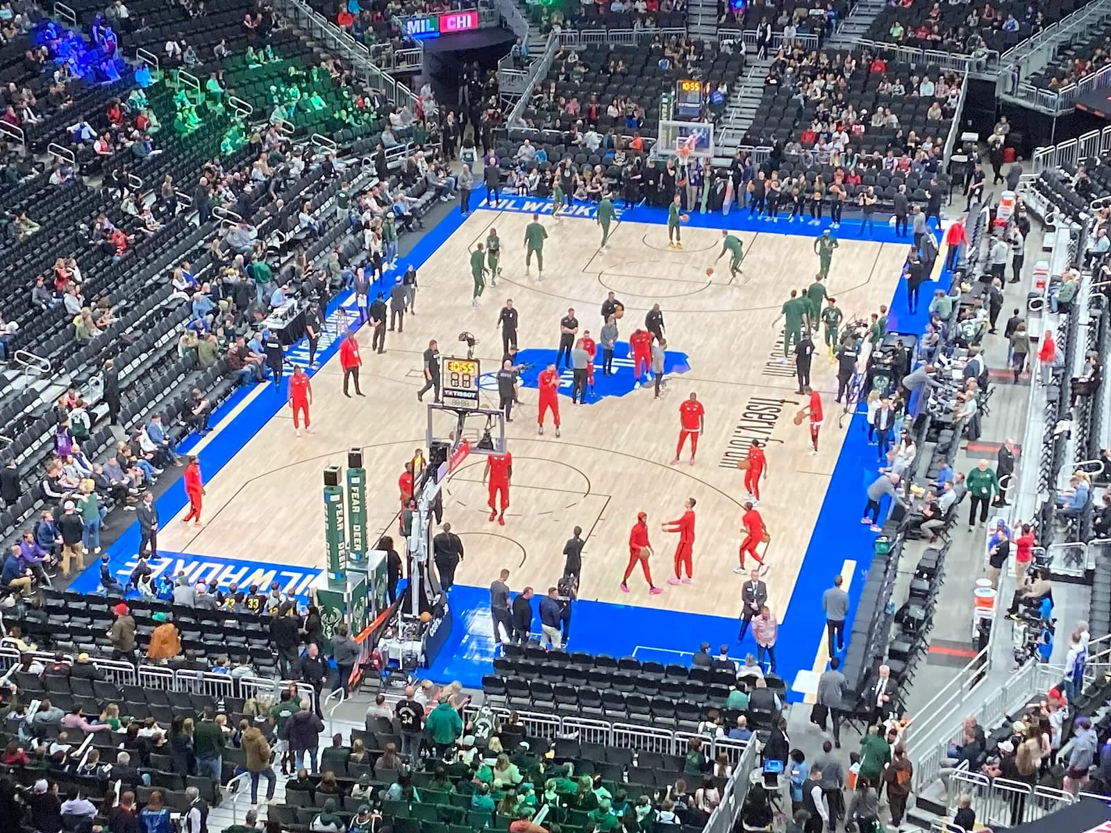Milwaukee Bucks players warm up at Fiserv Forum before a game against the Chicago Bulls.