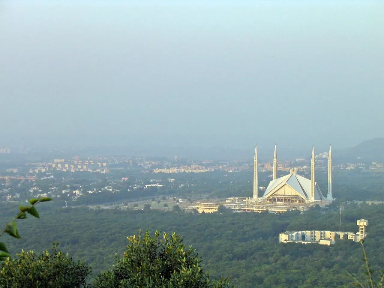 Faisal Mosque with a hazy view across Islamabad, Pakistan
