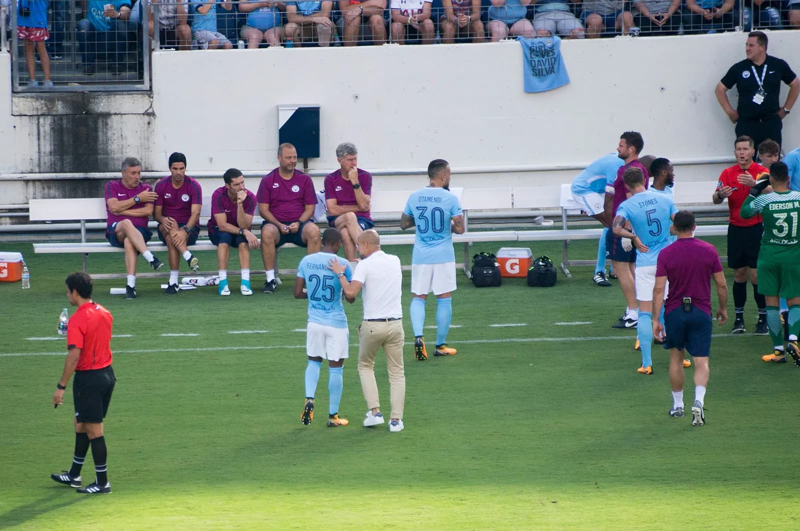 Pep Guardiola speaks to Fernandinho during Manchester City’s match against Tottenham Hotspur.